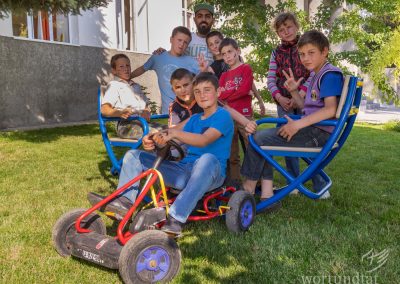 Boys posing together with supervisor